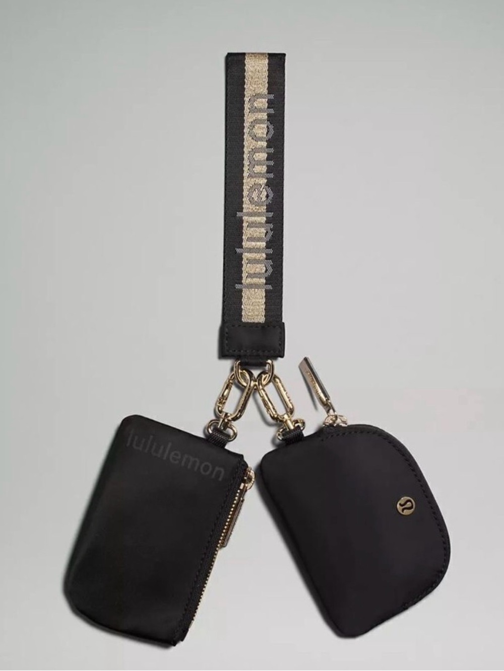 NWT lululemon athletica Dual Pouch Wristlet Metallic Wordmark in Black/Gold